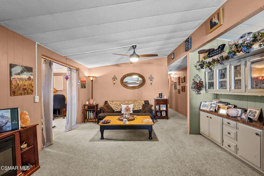 1550 Rory Lane, Unit 239 Simi Valley, CA 93063 - Photo 11 of 37 a living room with furniture and flat screen tv
