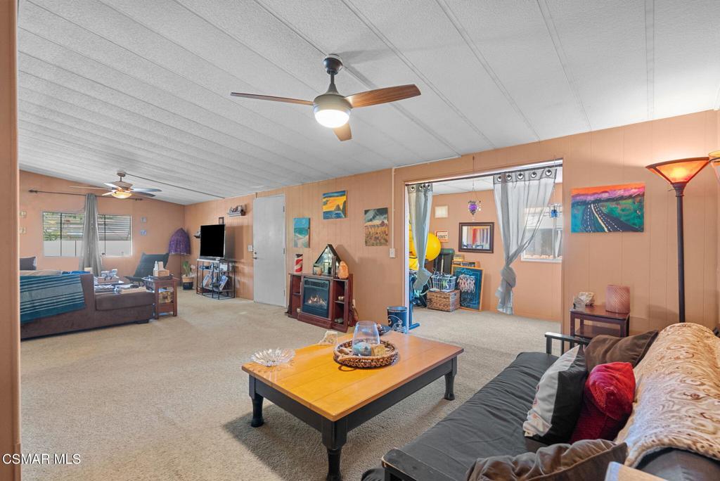 1550 Rory Lane, Unit 239 Simi Valley, CA 93063 - Photo 12 of 37 a living room with furniture and a window