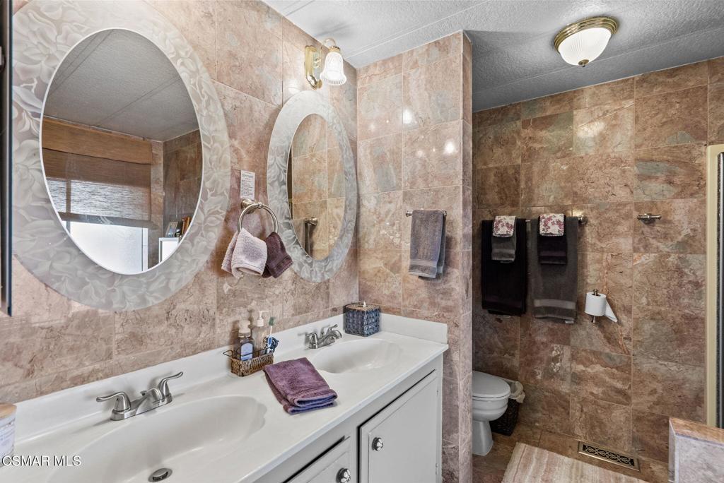 1550 Rory Lane, Unit 239 Simi Valley, CA 93063 - Photo 20 of 37 a bathroom with a sink a toilet and shower