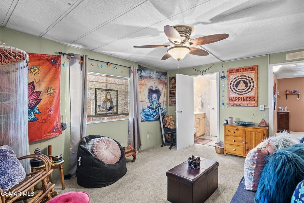 1550 Rory Lane, Unit 239 Simi Valley, CA 93063 - Photo 23 of 37 a living room with furniture and a window