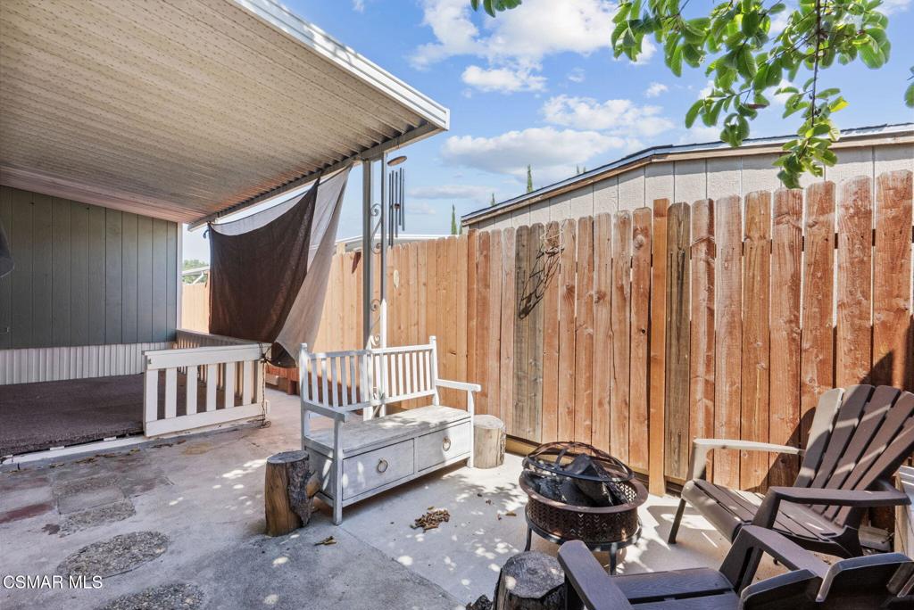1550 Rory Lane, Unit 239 Simi Valley, CA 93063 - Photo 31 of 37 a balcony with furniture and wooden floor