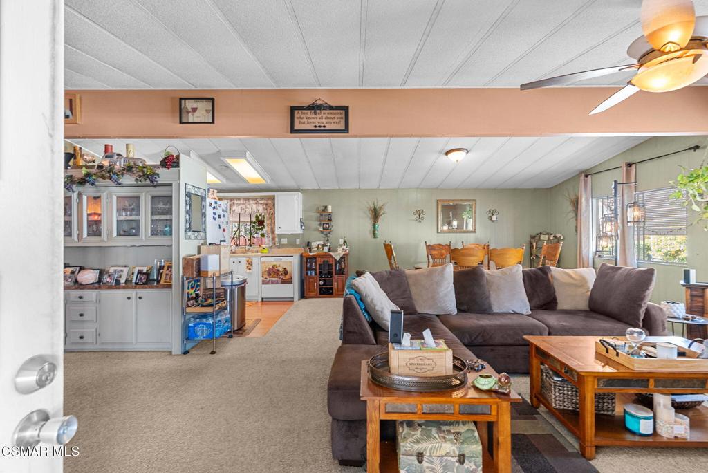 1550 Rory Lane, Unit 239 Simi Valley, CA 93063 - Photo 4 of 37 a living room with furniture and a flat screen tv