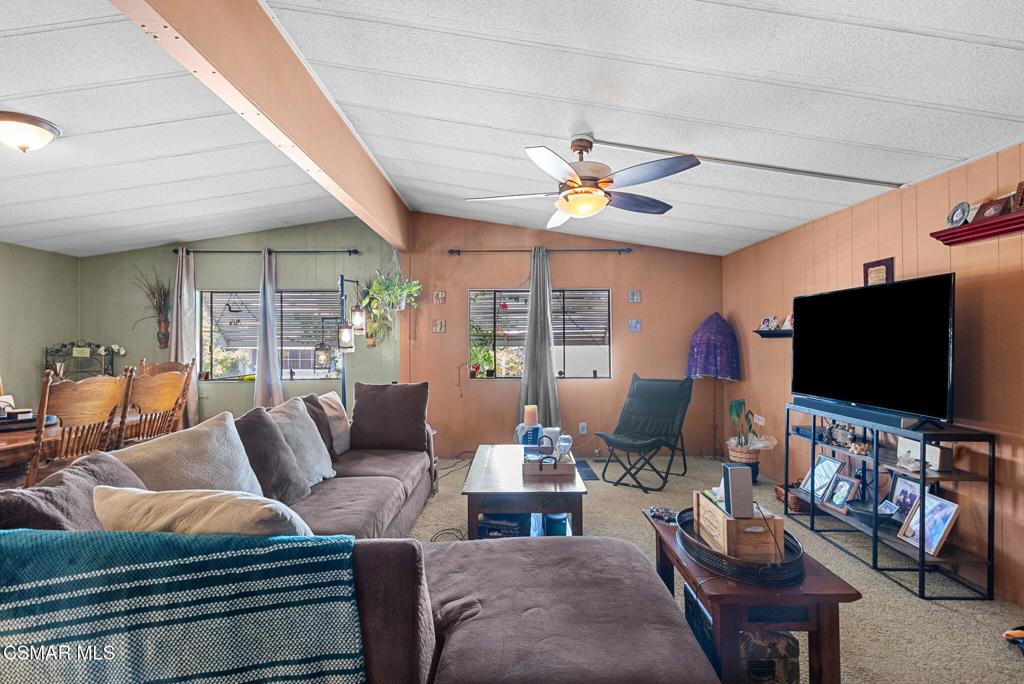 1550 Rory Lane, Unit 239 Simi Valley, CA 93063 - Photo 6 of 37 a living room with furniture and a flat screen tv