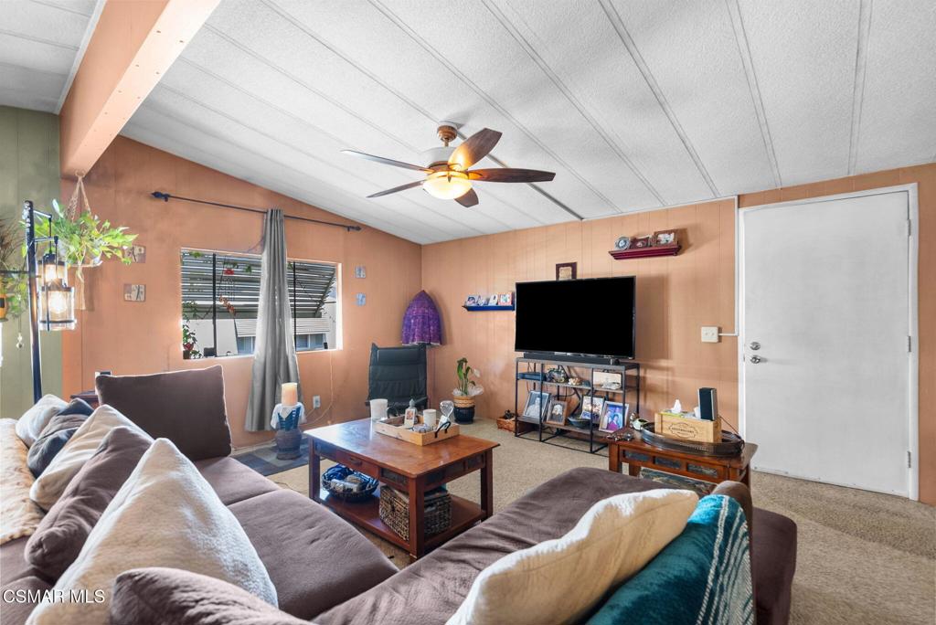 1550 Rory Lane, Unit 239 Simi Valley, CA 93063 - Photo 7 of 37 a living room with furniture and a flat screen tv