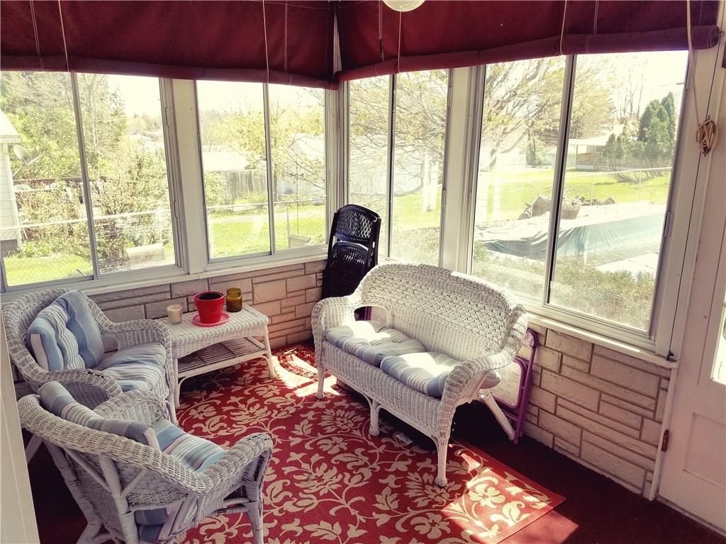 213 Linhurst Avenue Butler, PA 16001 - Photo 18 of 24 Large Sunroom off back of the house with lovely pool view.