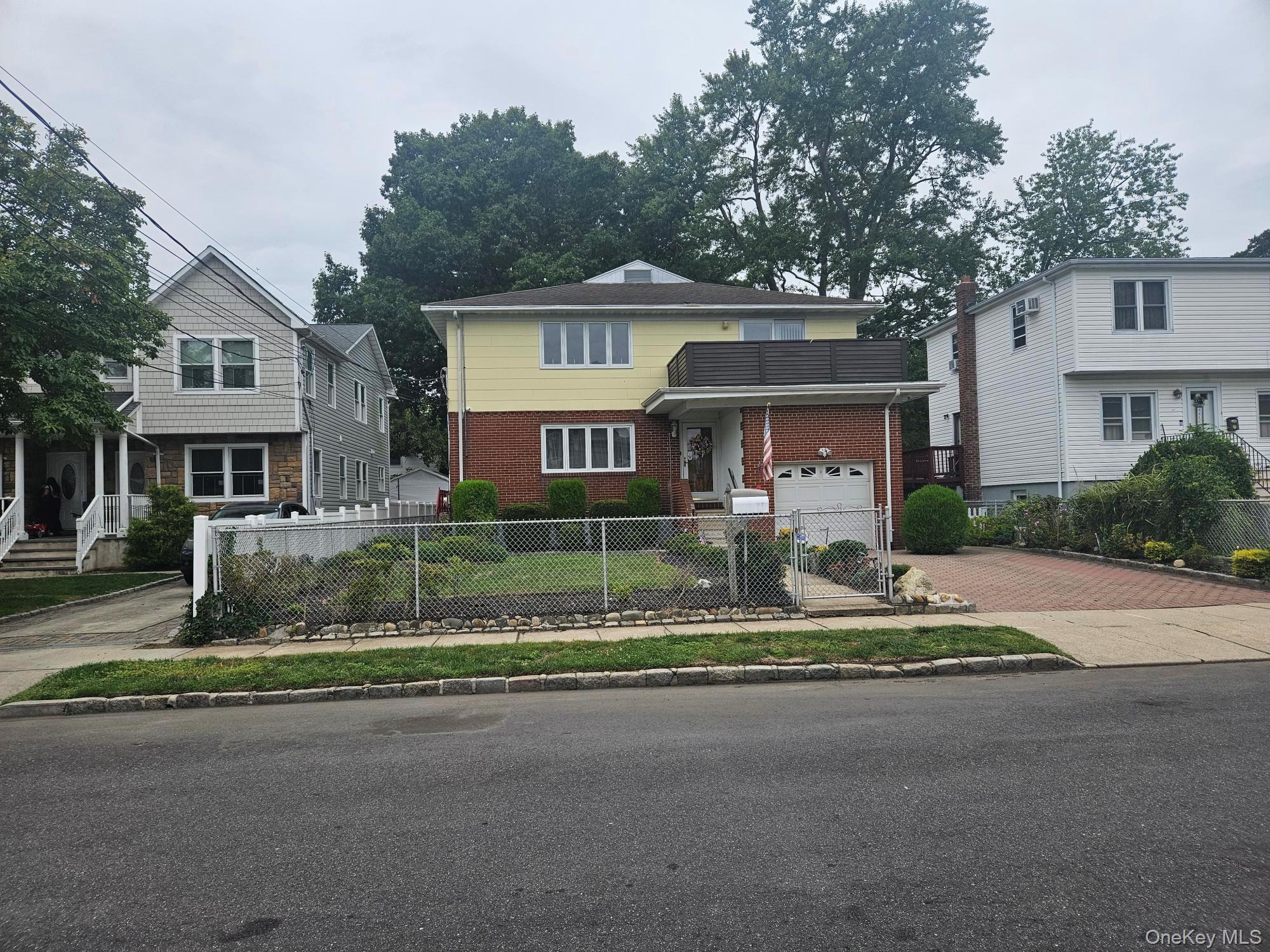 front view of a house with a street