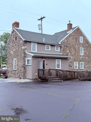 a front view of a house with a lot of windows
