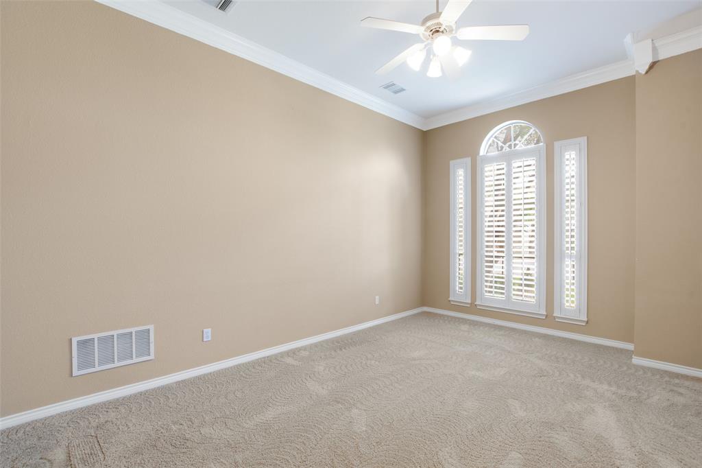 850 Turquoise Point Rockwall, TX 75032 - Photo 11 of 40 an empty room with windows and chandelier fan