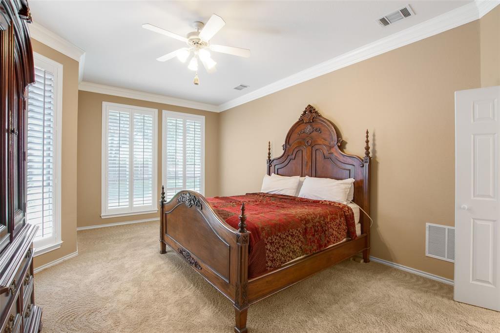 850 Turquoise Point Rockwall, TX 75032 - Photo 21 of 40 a bed room with a bed and a painting