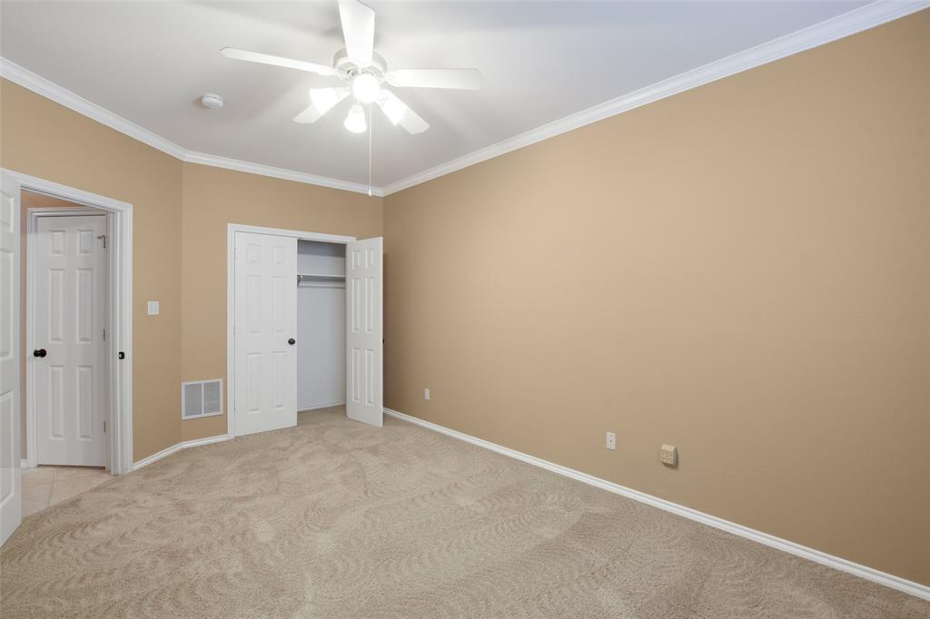 850 Turquoise Point Rockwall, TX 75032 - Photo 28 of 40 an empty room with a chandelier fan and closet area