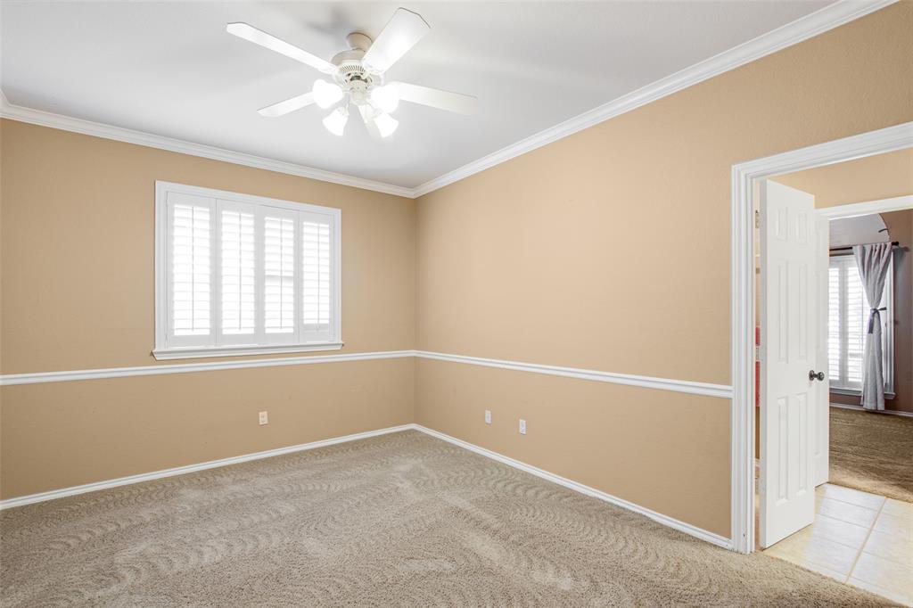850 Turquoise Point Rockwall, TX 75032 - Photo 30 of 40 an empty room with windows and ceiling fan
