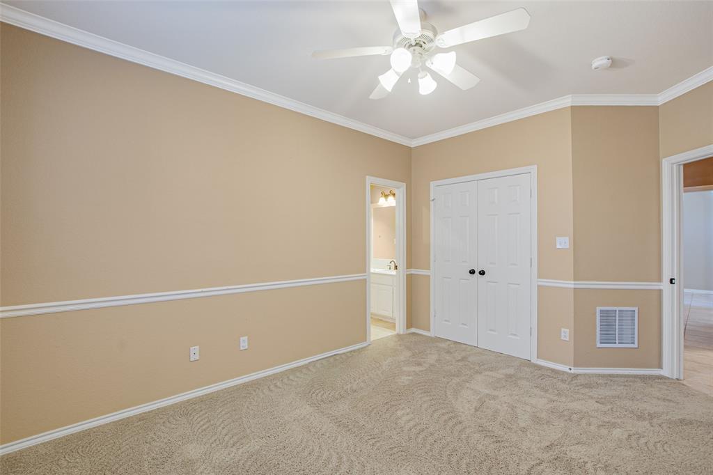 850 Turquoise Point Rockwall, TX 75032 - Photo 31 of 40 an empty room with a ceiling fan and a window