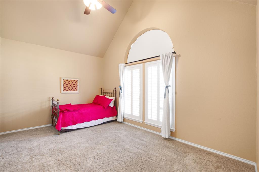 850 Turquoise Point Rockwall, TX 75032 - Photo 33 of 40 an empty room with a ceiling fan and window
