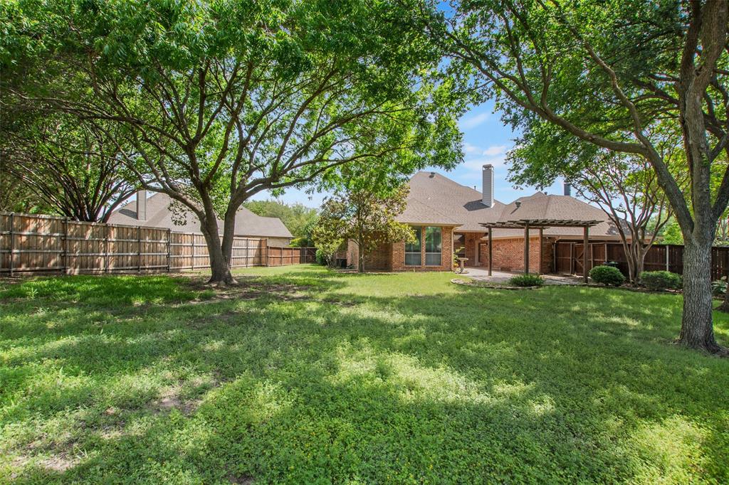 850 Turquoise Point Rockwall, TX 75032 - Photo 38 of 40 a front view of a house with yard and green space