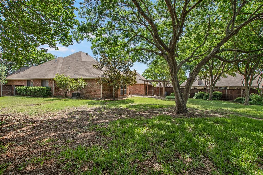 850 Turquoise Point Rockwall, TX 75032 - Photo 39 of 40 a view of a house with a yard
