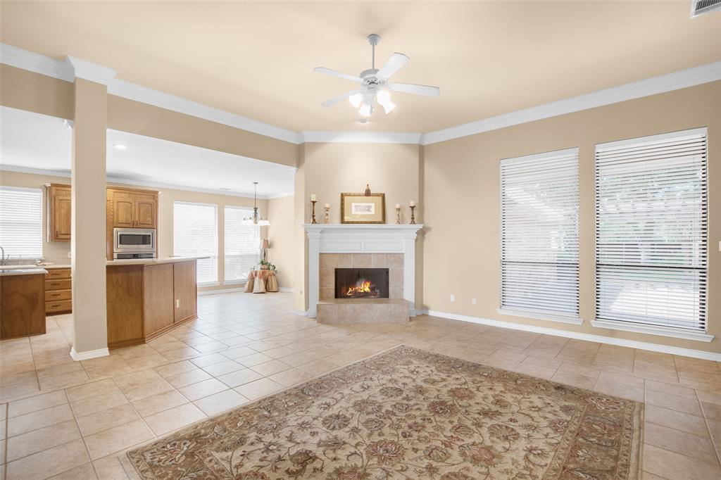 850 Turquoise Point Rockwall, TX 75032 - Photo 5 of 40 a view of an empty room with a fireplace and a window