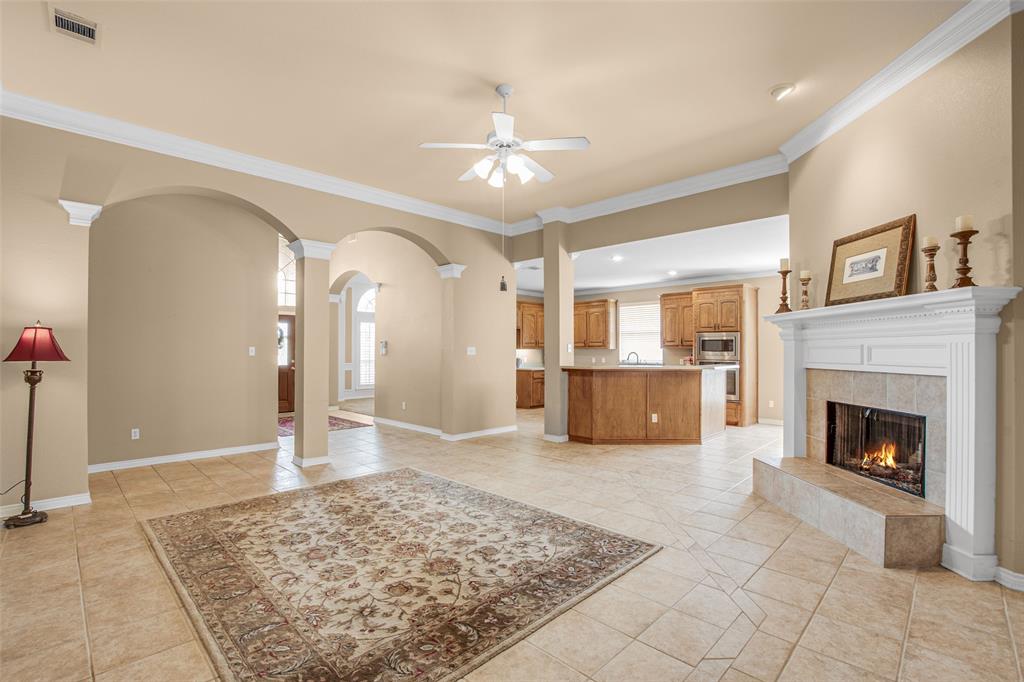 850 Turquoise Point Rockwall, TX 75032 - Photo 6 of 40 a view of a livingroom with wooden floor and a fireplace
