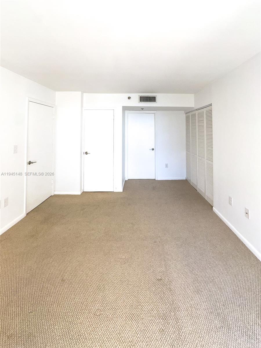 540 Brickell Key Drive, Unit 1201 Miami, FL 33131 - Photo 12 of 18 an empty room with a bathroom