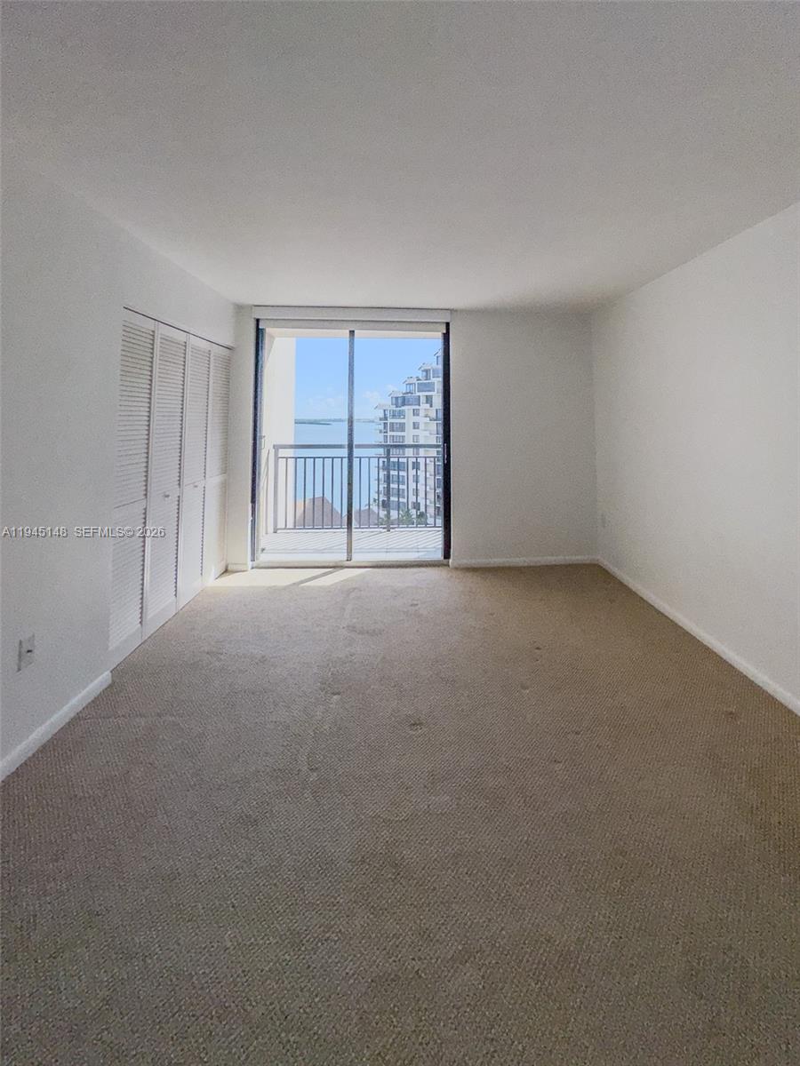 540 Brickell Key Drive, Unit 1201 Miami, FL 33131 - Photo 13 of 18 a view of an empty room with a window