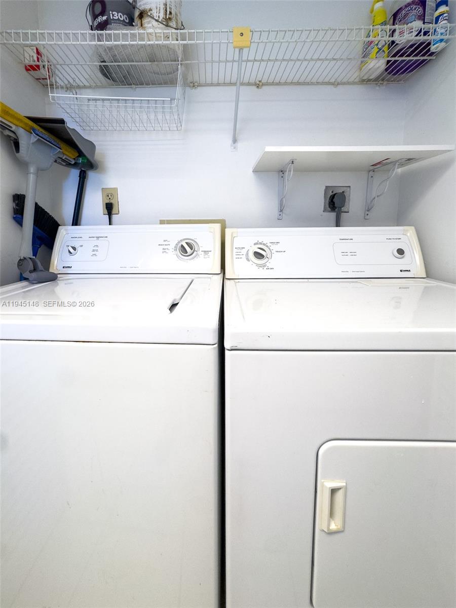540 Brickell Key Drive, Unit 1201 Miami, FL 33131 - Photo 18 of 18 a close view of washer and dryer