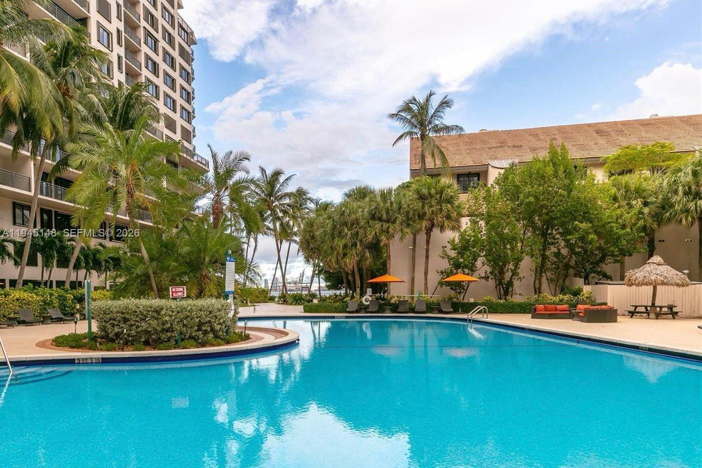 540 Brickell Key Drive, Unit 1201 Miami, FL 33131 - Photo 6 of 18 a view of a lake with houses