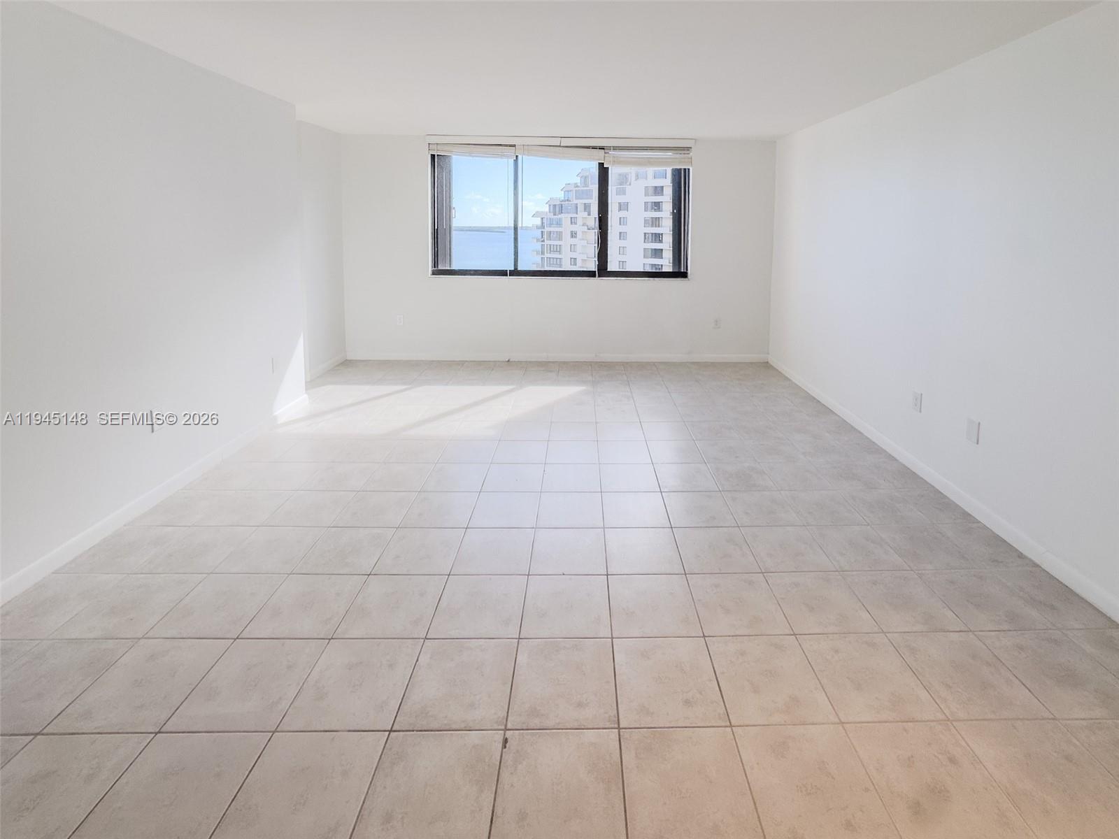 540 Brickell Key Drive, Unit 1201 Miami, FL 33131 - Photo 7 of 18 a view of an empty room with a window