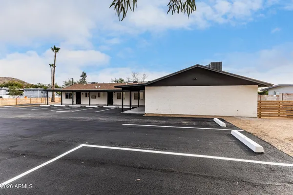 a front view of a house with yard