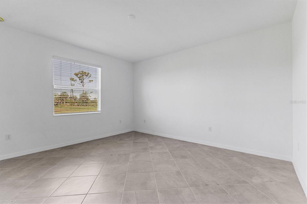 19095 Cabernet Court Venice, FL 34293 - Photo 13 of 76 an empty room with windows