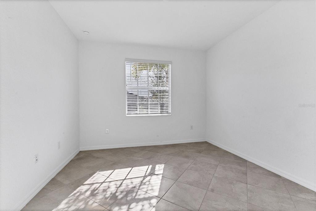 19095 Cabernet Court Venice, FL 34293 - Photo 18 of 76 an empty room with windows