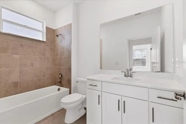 a view of a house with a backyard patio and swimming pool