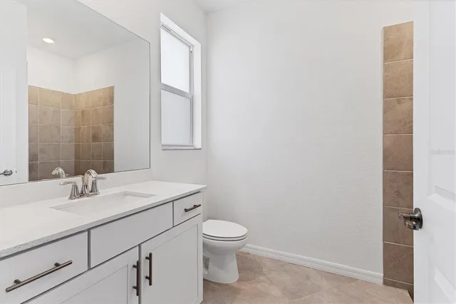 an aerial view of a house with a lake view