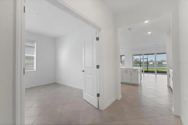 a front view of a building with sitting area