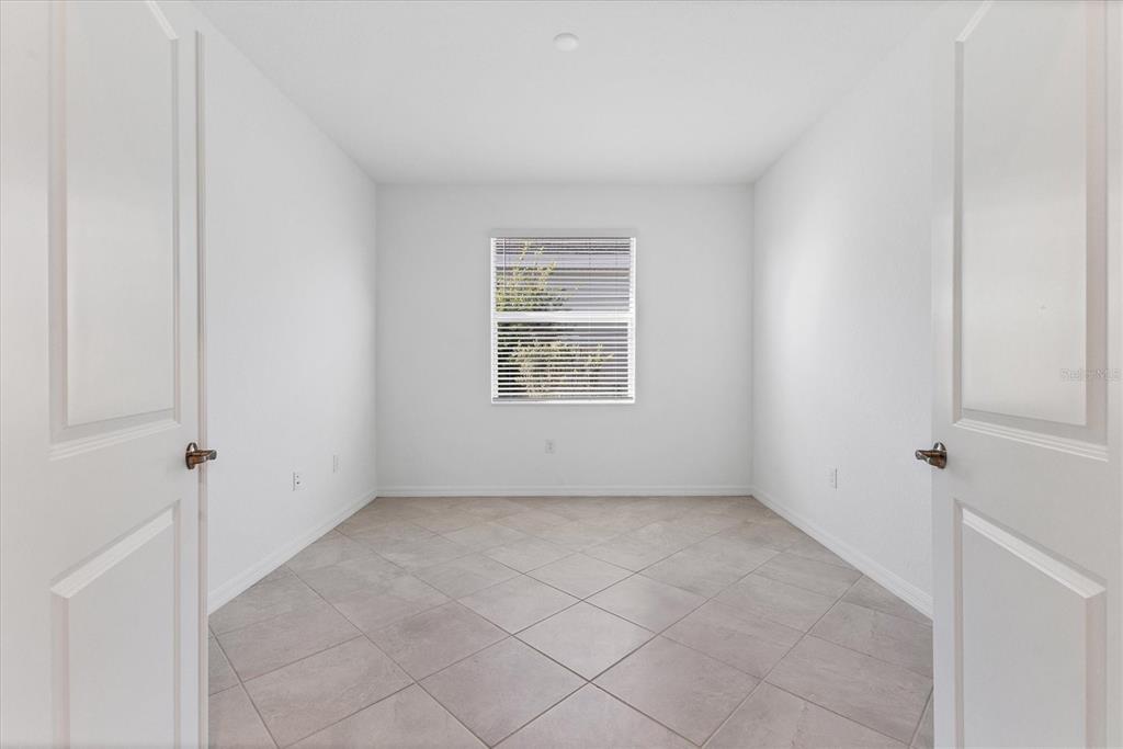 19095 Cabernet Court Venice, FL 34293 - Photo 25 of 76 a view of an empty room with a window