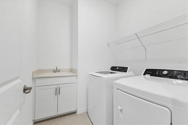 a view of a lake with boats and trees in the background