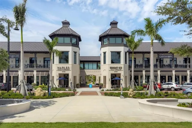 an aerial view of a building with garden view and lake view