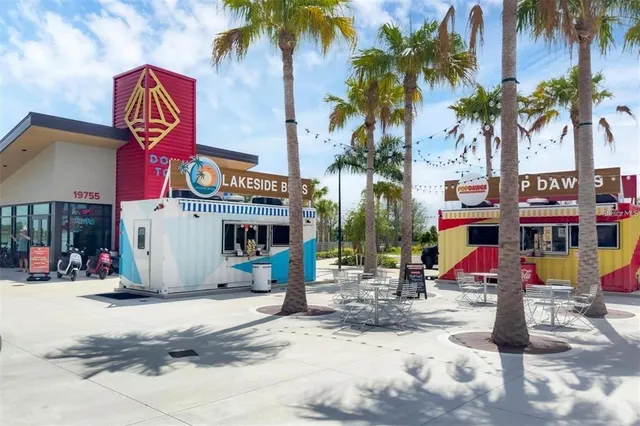 a view of a house with a yard and plants