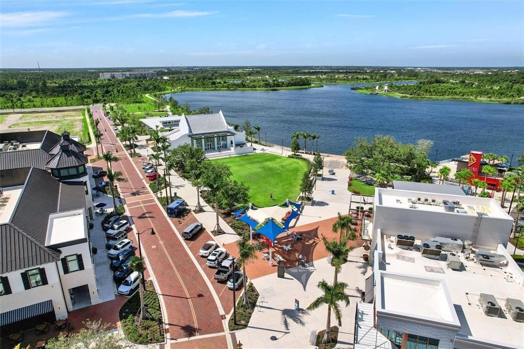 19095 Cabernet Court Venice, FL 34293 - Photo 32 of 76 an aerial view of a house with a lake view