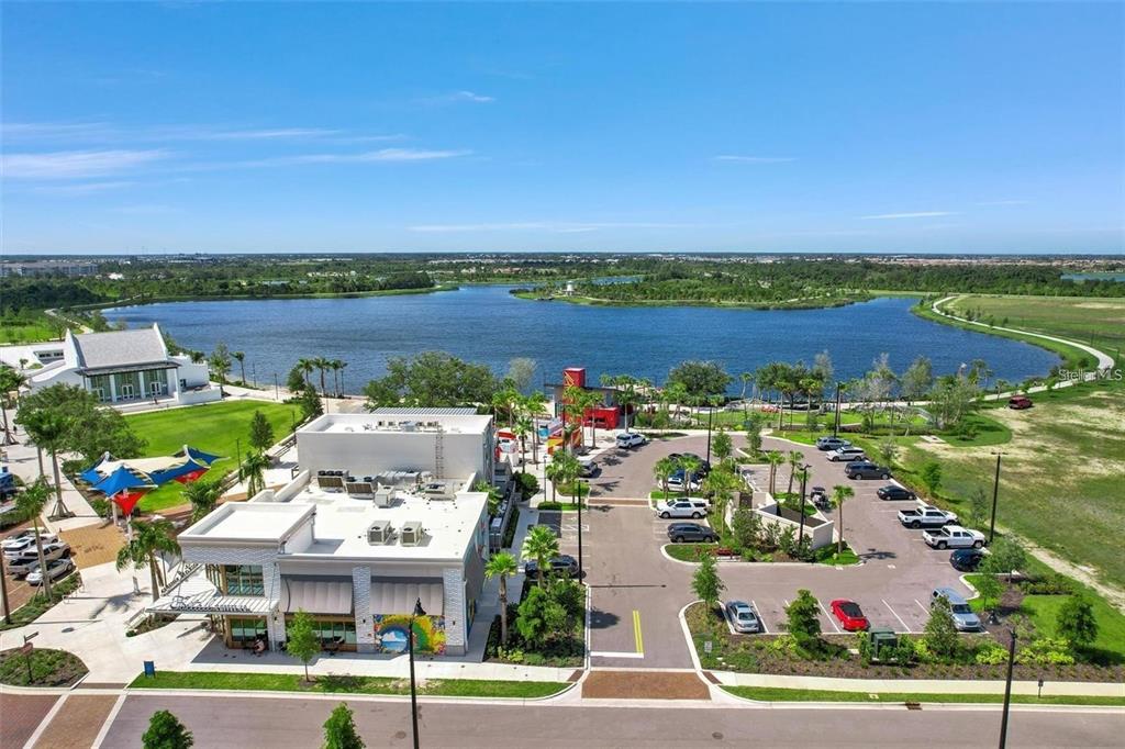 19095 Cabernet Court Venice, FL 34293 - Photo 41 of 76 an aerial view of a building with garden view and lake view
