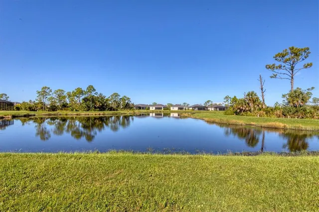 a swimming pool with trees in the background