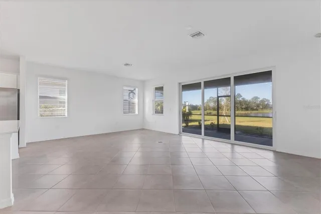 a kitchen with stainless steel appliances granite countertop a sink dishwasher stove and microwave with wooden cabinets