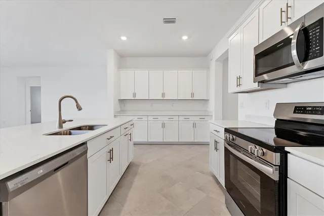 a bathroom with a double vanity sink and mirror