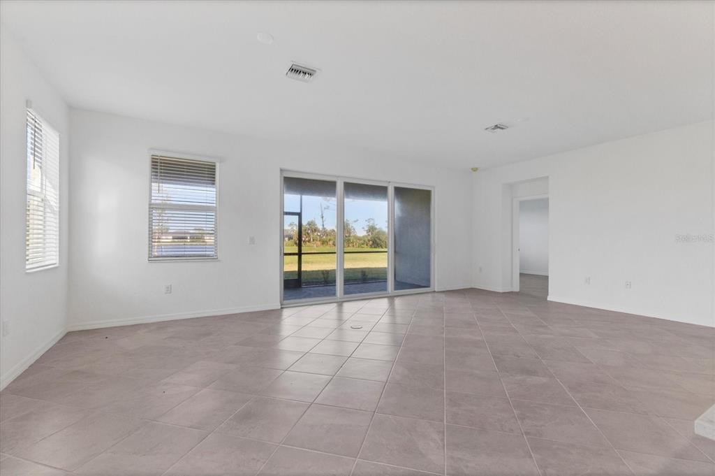19095 Cabernet Court Venice, FL 34293 - Photo 10 of 76 a view of an empty room with a window