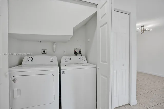 a utility room with dryer and washer