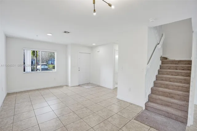 a view of an entryway with stairs