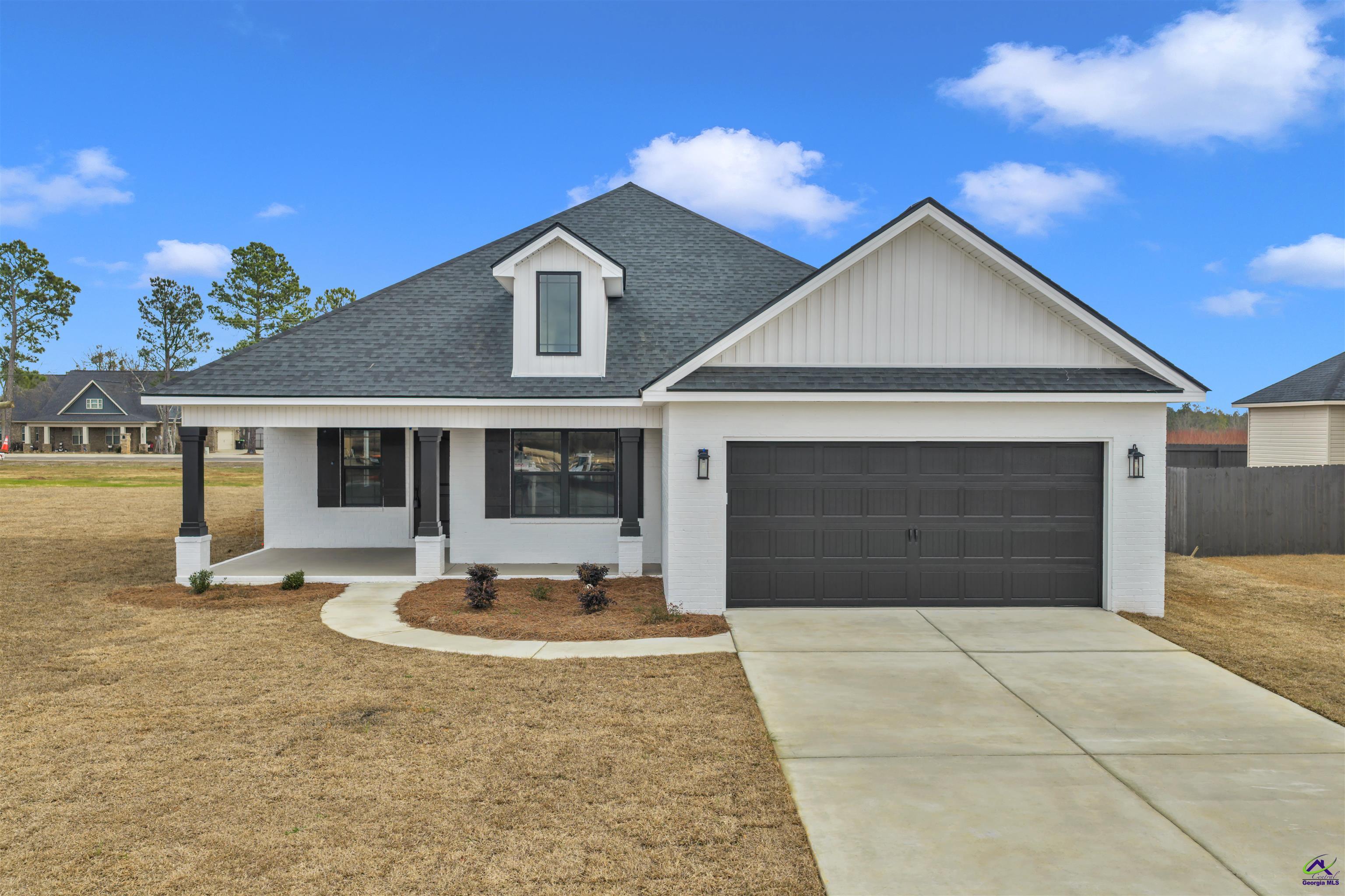 103 Early Drive Byron, GA 31008 - Photo 1 of 56 a front view of a house with garden