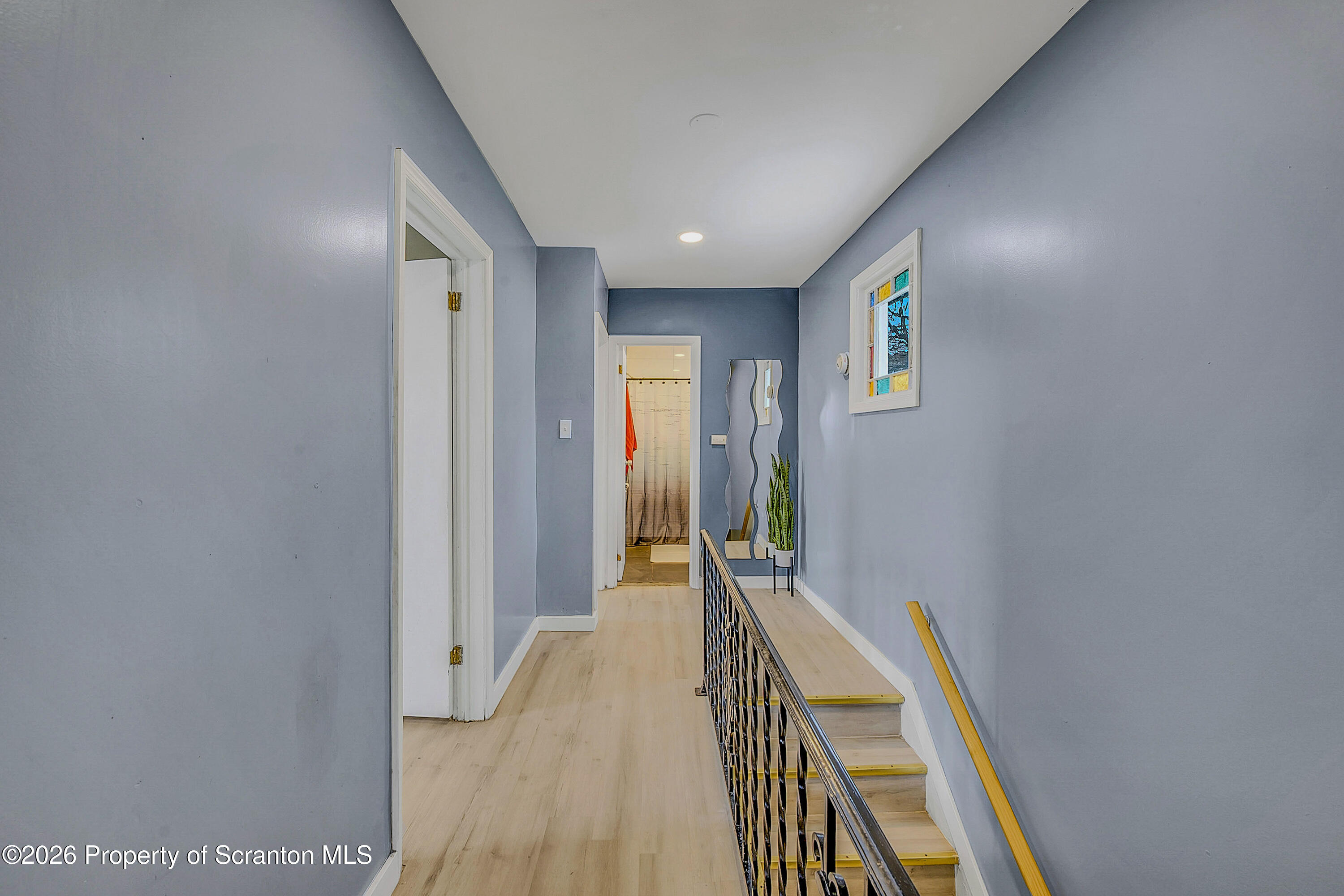 215 North Fillmore Avenue Scranton, PA 18504 - Photo 11 of 25 a view of a hallway with wooden floor and staircase