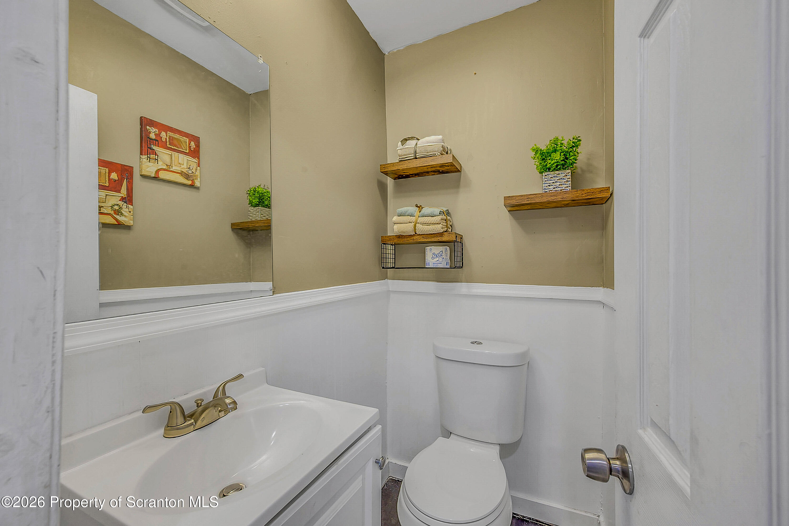 215 North Fillmore Avenue Scranton, PA 18504 - Photo 12 of 25 a bathroom with a sink a toilet and a mirror