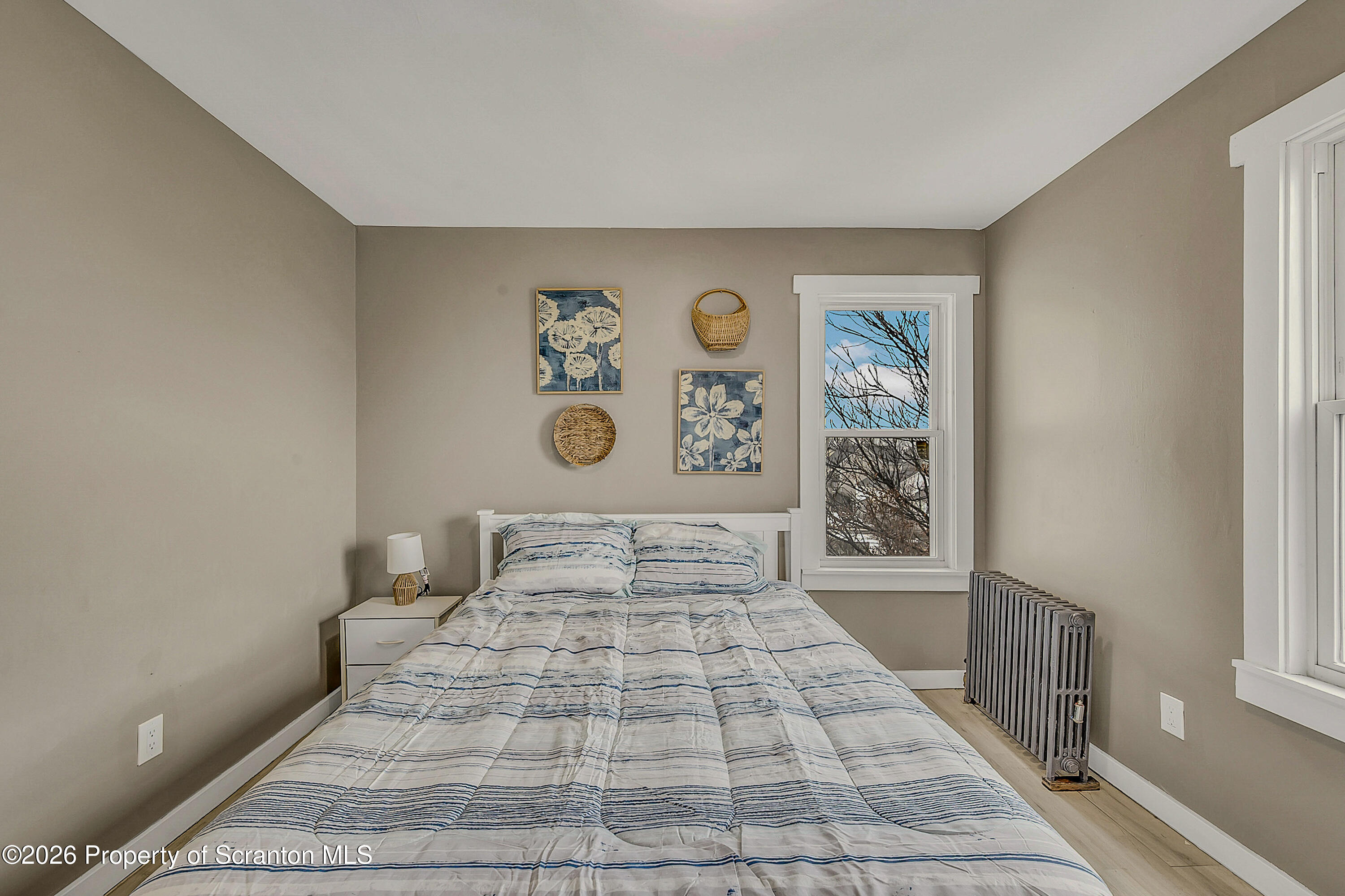 215 North Fillmore Avenue Scranton, PA 18504 - Photo 14 of 25 a bedroom with a large bed and a window