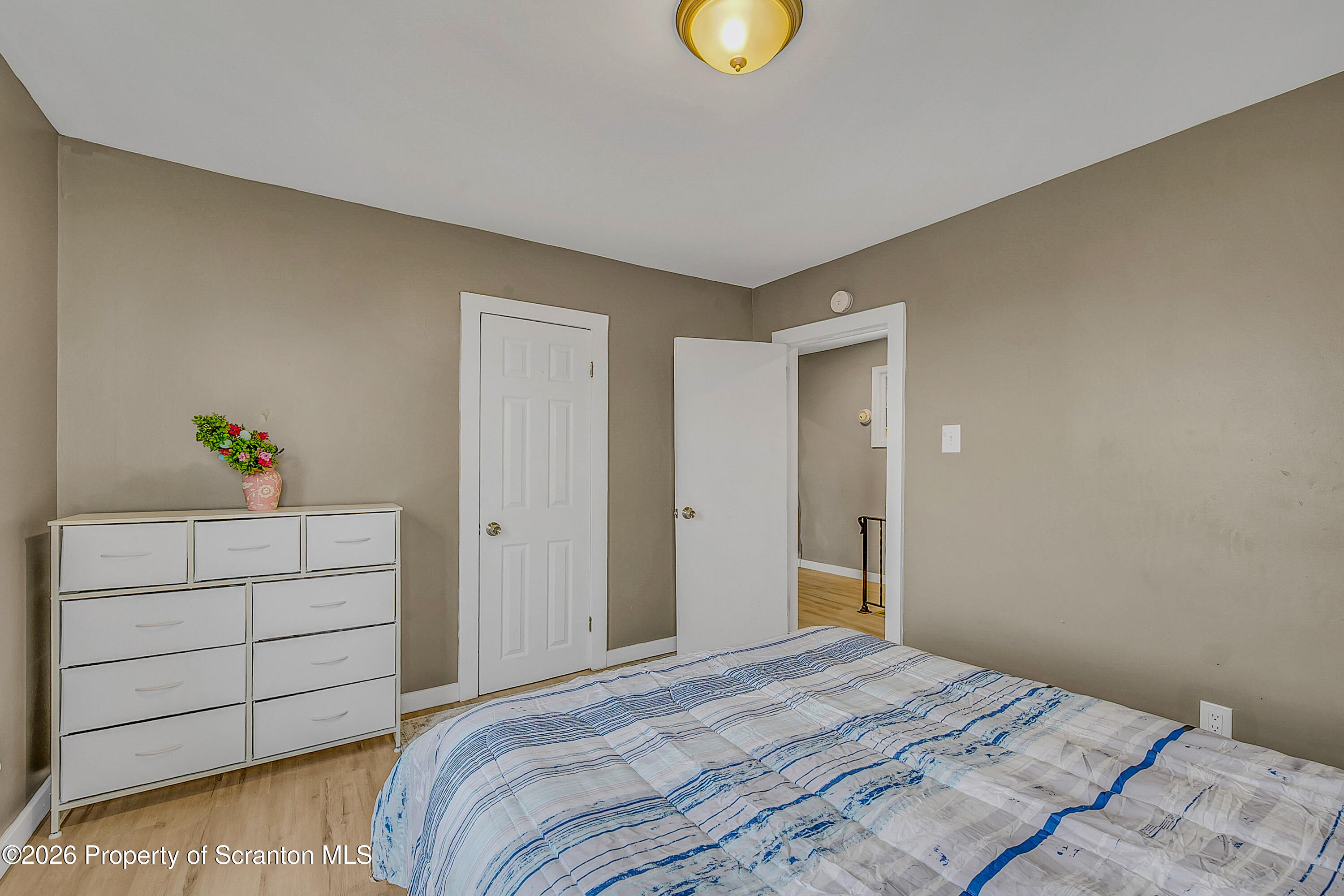 215 North Fillmore Avenue Scranton, PA 18504 - Photo 15 of 25 a bedroom with a bed and cabinets
