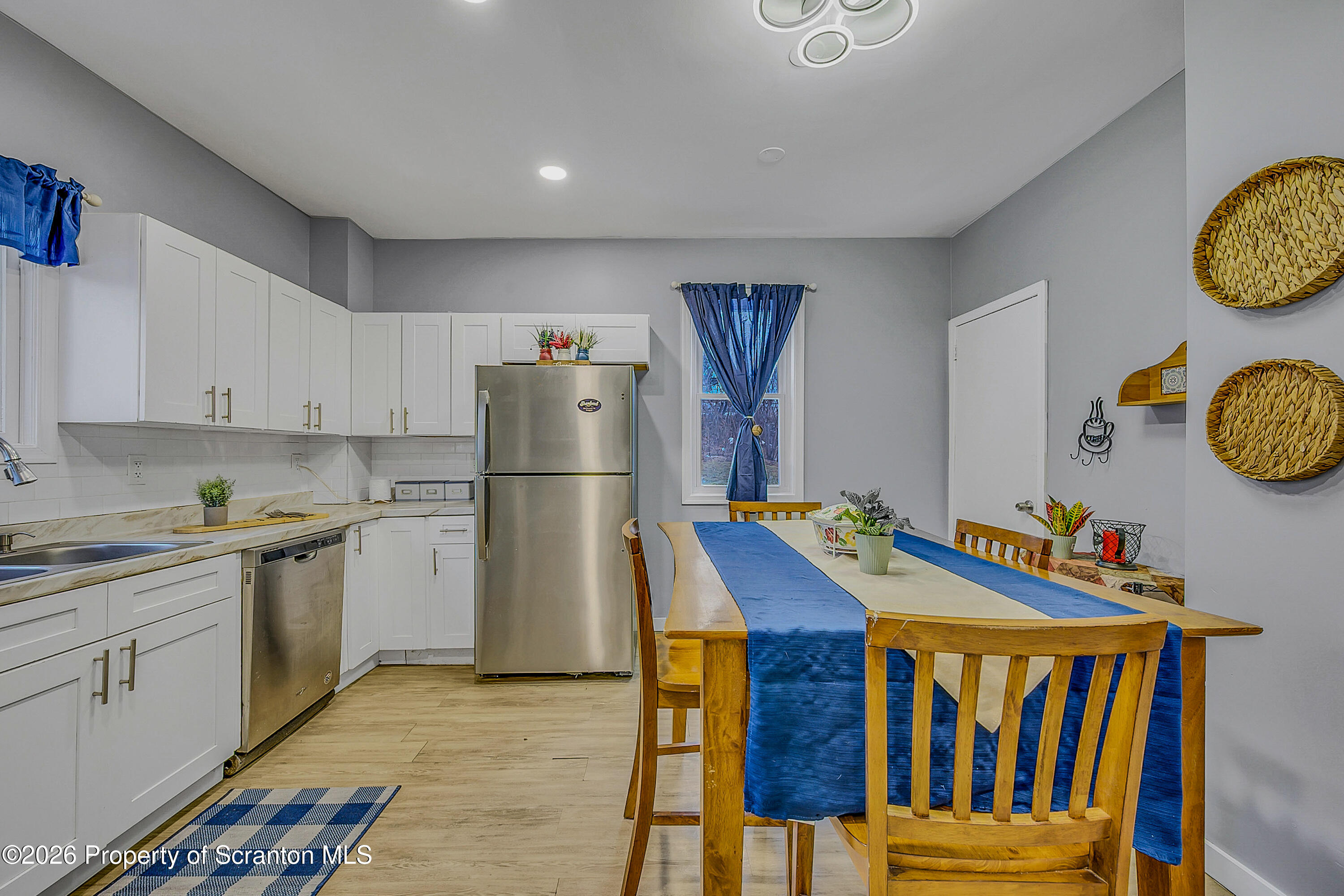 215 North Fillmore Avenue Scranton, PA 18504 - Photo 7 of 25 a kitchen with stainless steel appliances granite countertop a refrigerator and a stove top oven